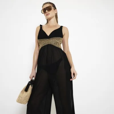 Black Mesh Jumpsuit sold by River Island