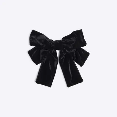 Black velvet bow hairclip sold by River Island