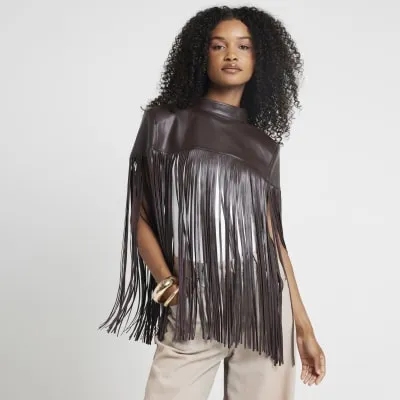 Brown faux leather tassel hem cape sold by River Island
