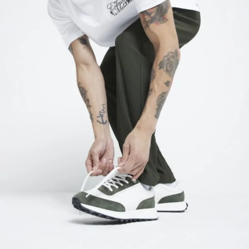 Green leather lace up trainers sold by River Island