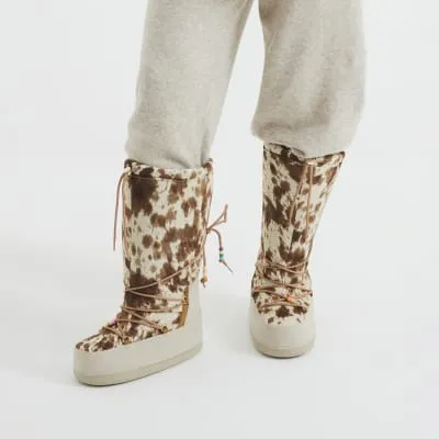 Beige Leather High Leg Cow Print Ski Boots sold by River Island