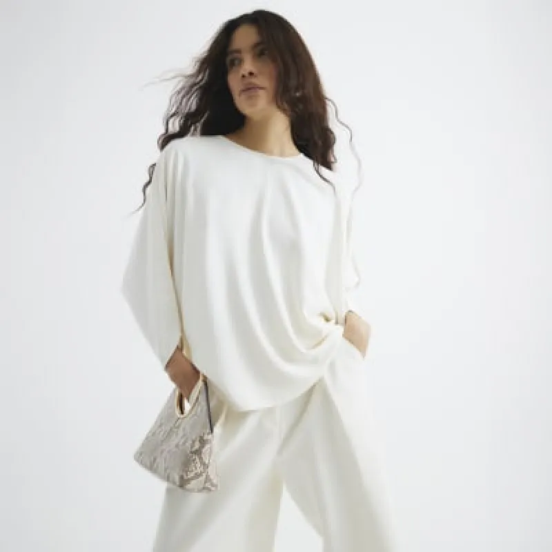 Cream Batwing Sleeve Top sold by River Island
