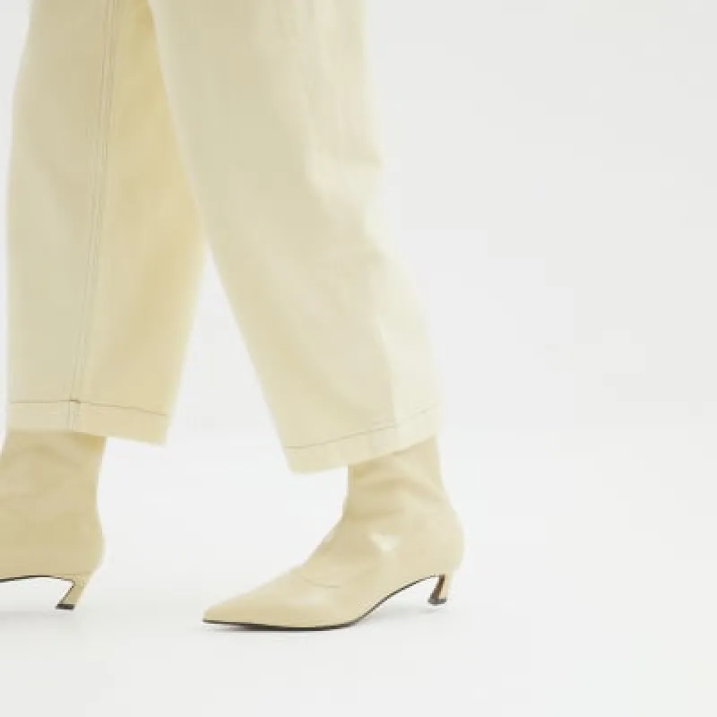 Yellow Slanted Kitten Heel Sock Boots sold by River Island