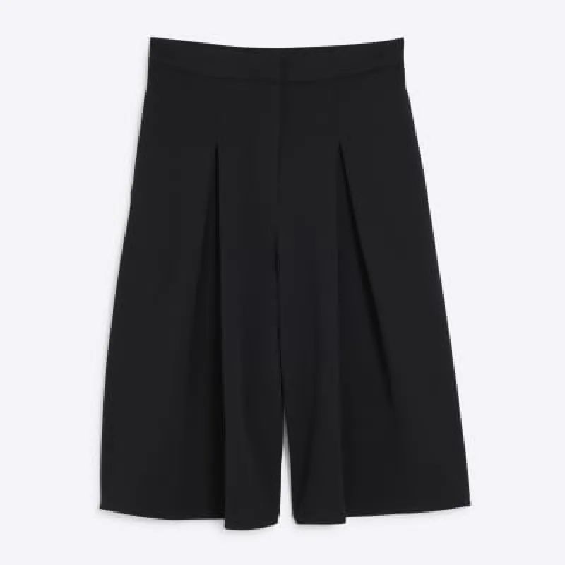 Petite Black pleat wide leg culotte trousers sold by River Island
