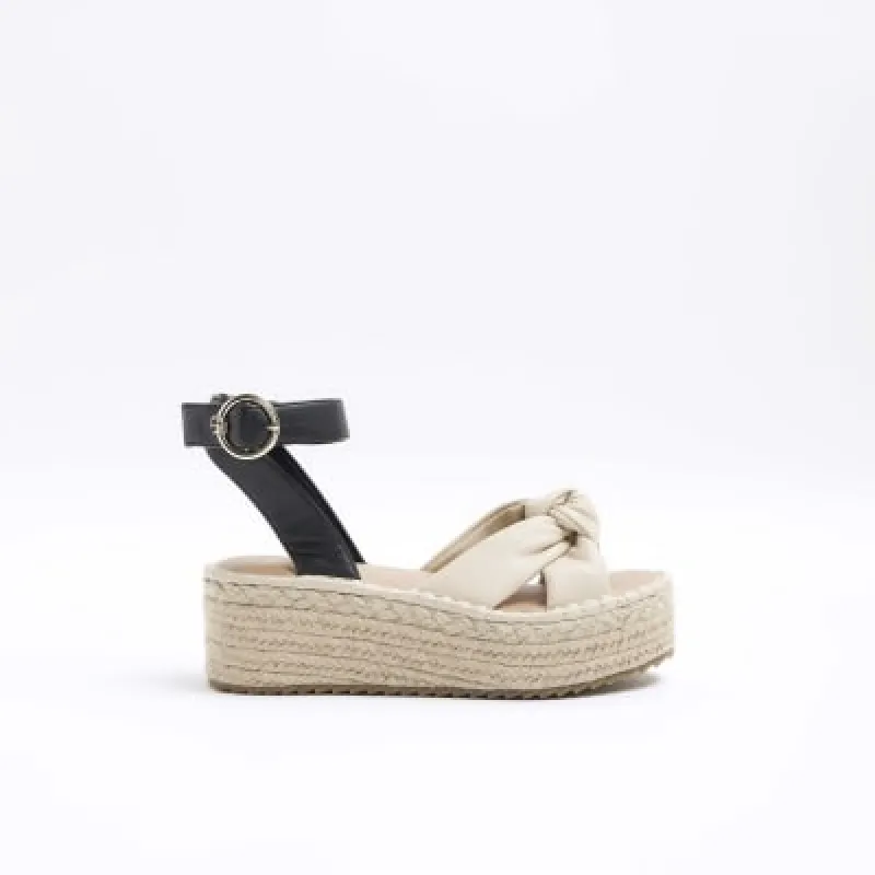 Pink knot flatform espadrille sandals sold by River Island