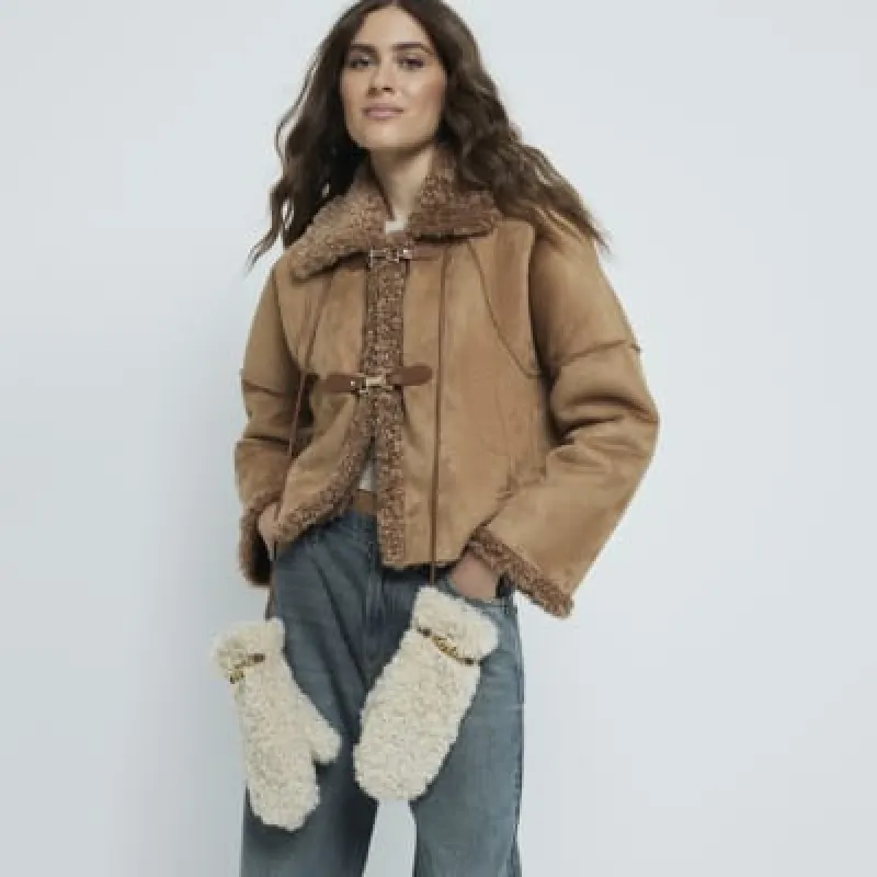 Beige Borg Snaffle Mittens sold by River Island