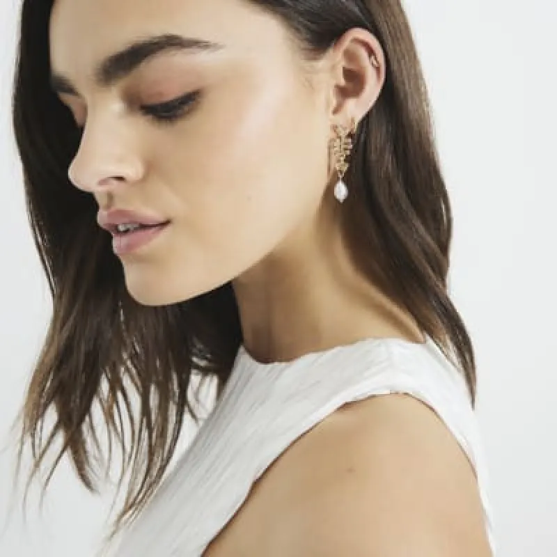 Gold Skeleton Fish Pearl Drop Earrings sold by River Island