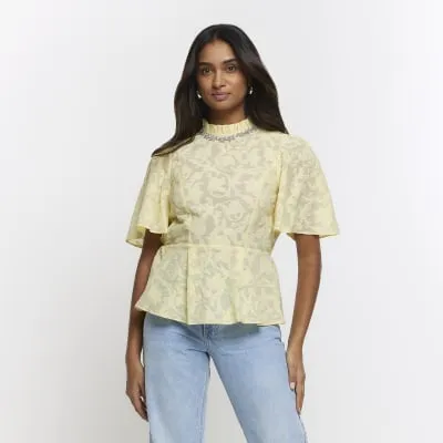 Yellow jacquard diamante trim blouse sold by River Island