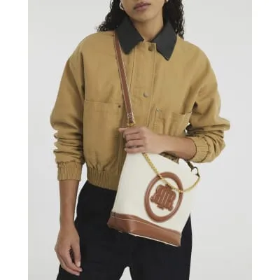 Cream Canvas Bucket Bag sold by River Island
