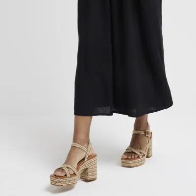 Beige raffia platform heeled sandals sold by River Island