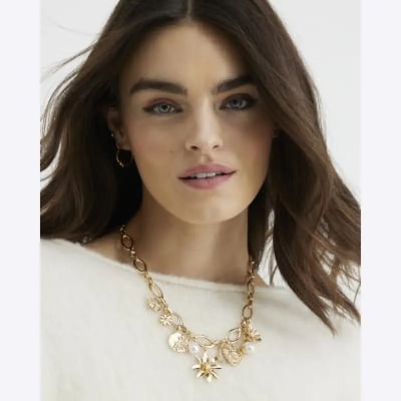 Gold Floral Charm Necklace sold by River Island