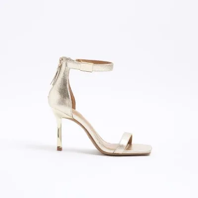 Gold clasp strap heeled sandals sold by River Island