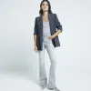 Grey high waisted flare jeans sold by River Island