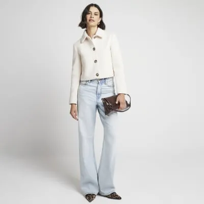 Cream collared crop trophy jacket sold by River Island