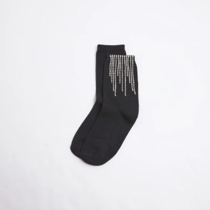 Black dangling diamante socks sold by River Island