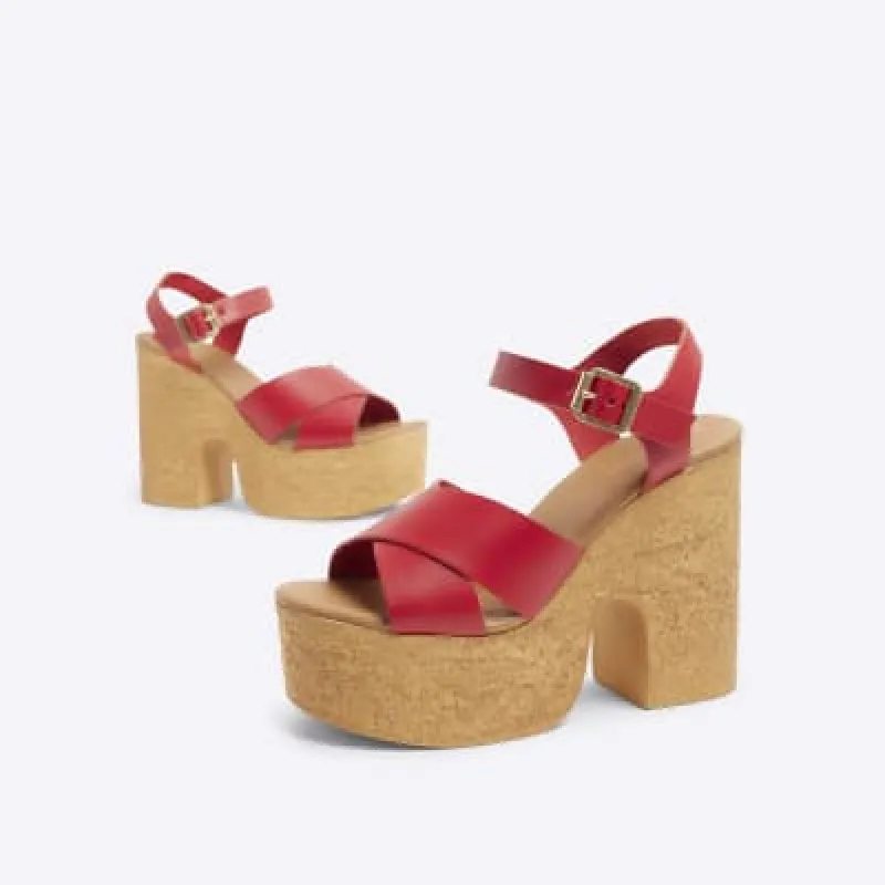 Red cross strap platform sandals sold by River Island