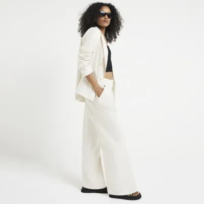Cream linen blend wide leg trousers sold by River Island