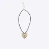 Black heart pendant cord necklace sold by River Island