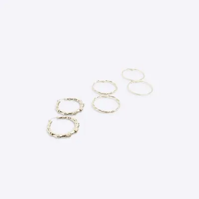 Gold twisted hoop earrings multipack sold by River Island