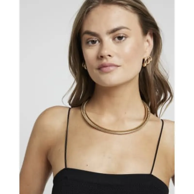 Gold watch strap necklace sold by River Island