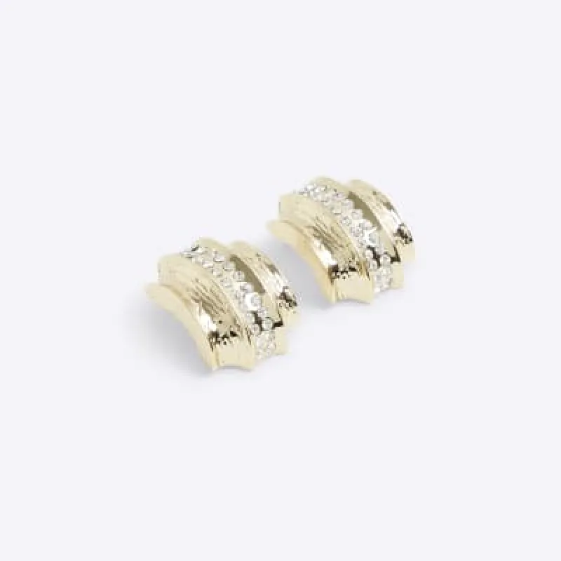 Gold diamante stud earrings sold by River Island
