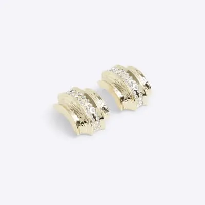 Gold diamante stud earrings sold by River Island
