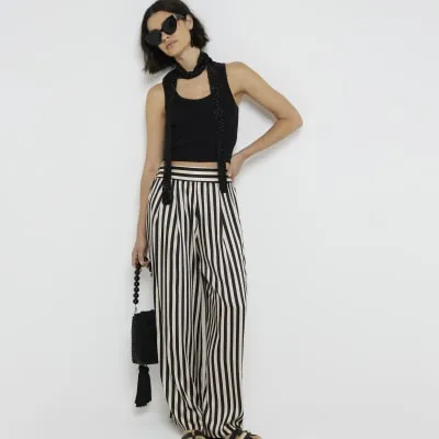 Beige stripe wide leg trousers sold by River Island