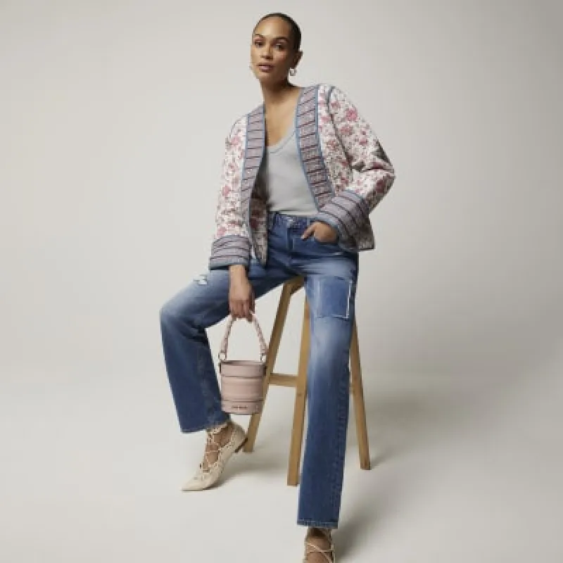 Blue patch stove pipe straight jeans sold by River Island