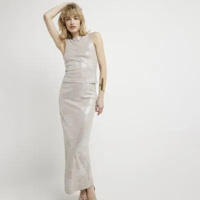 Beige glitter tank top sold by River Island