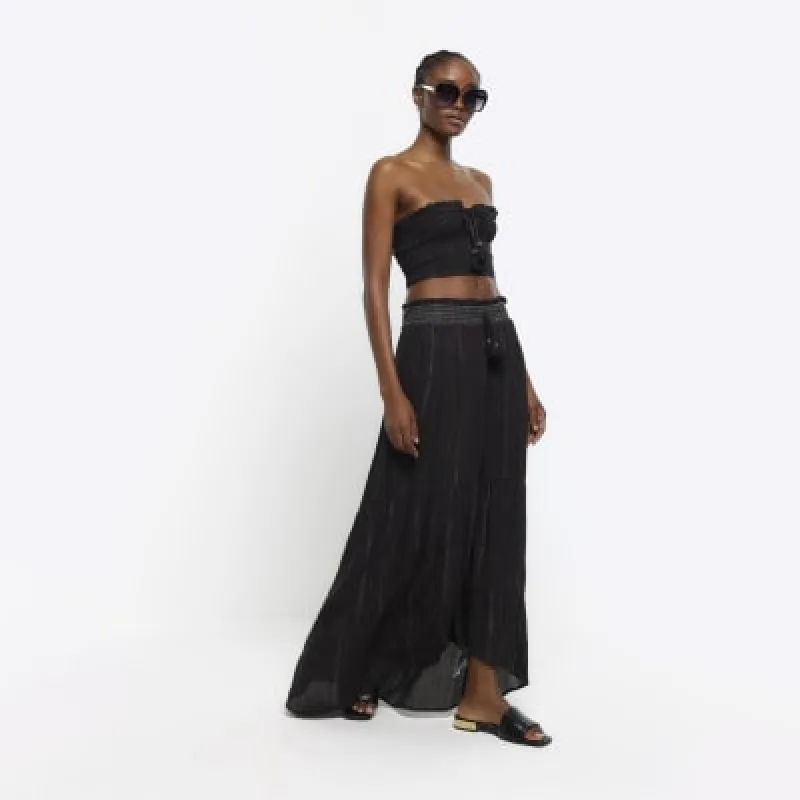 Black shirred metallic maxi skirt sold by River Island