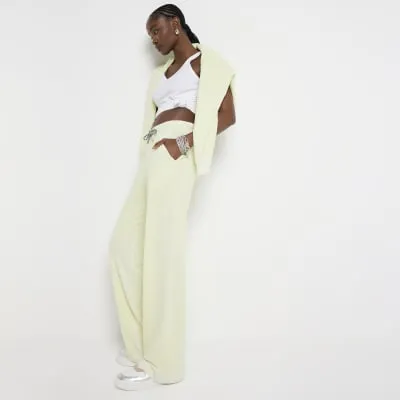 Lime green washed wide leg joggers sold by River Island