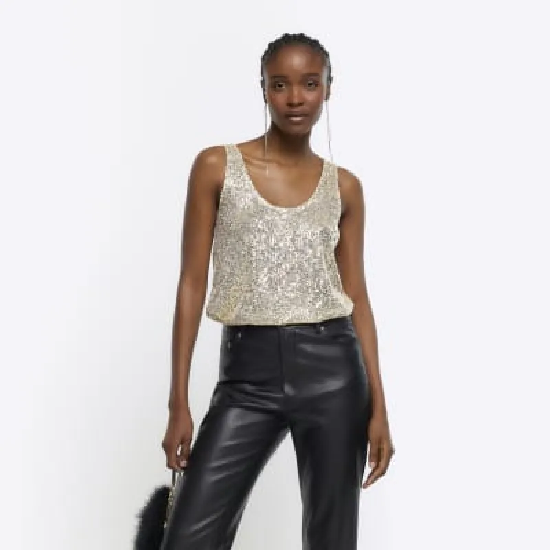 Gold sequin tank top sold by River Island