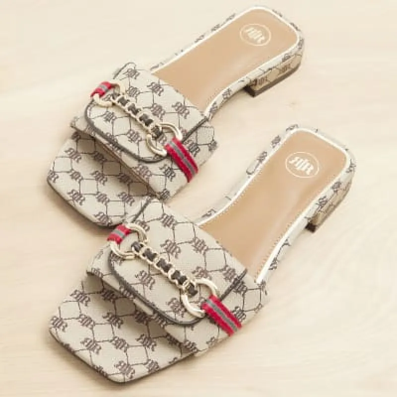 Beige monogram buckle mule sandals sold by River Island