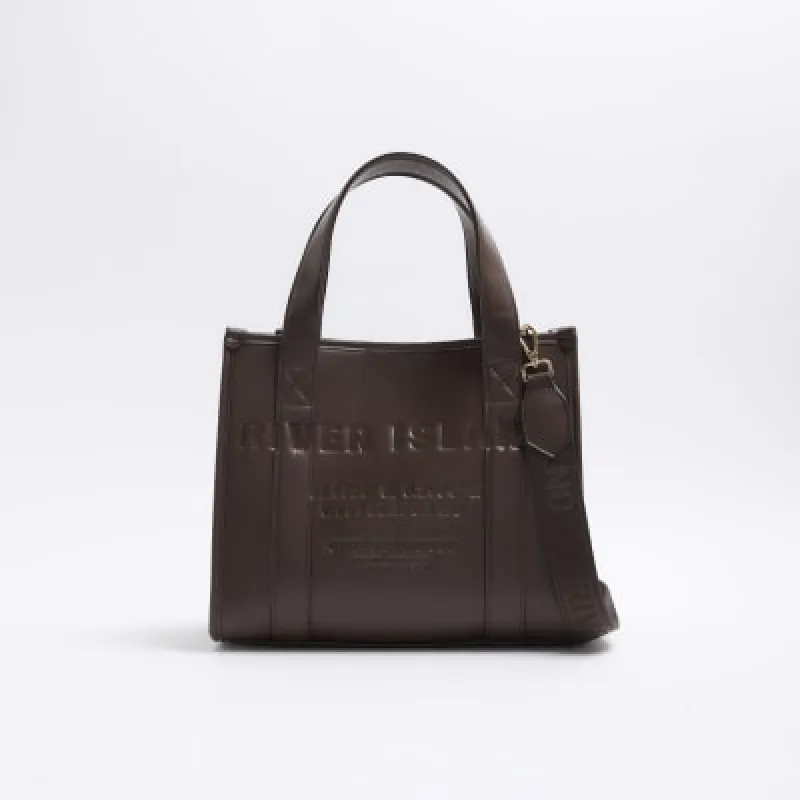 Brown embossed cross body tote bag sold by River Island