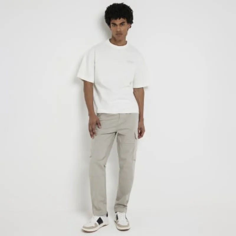 Stone regular fit cargo trousers sold by River Island