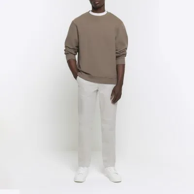 Grey slim fit chino trousers sold by River Island