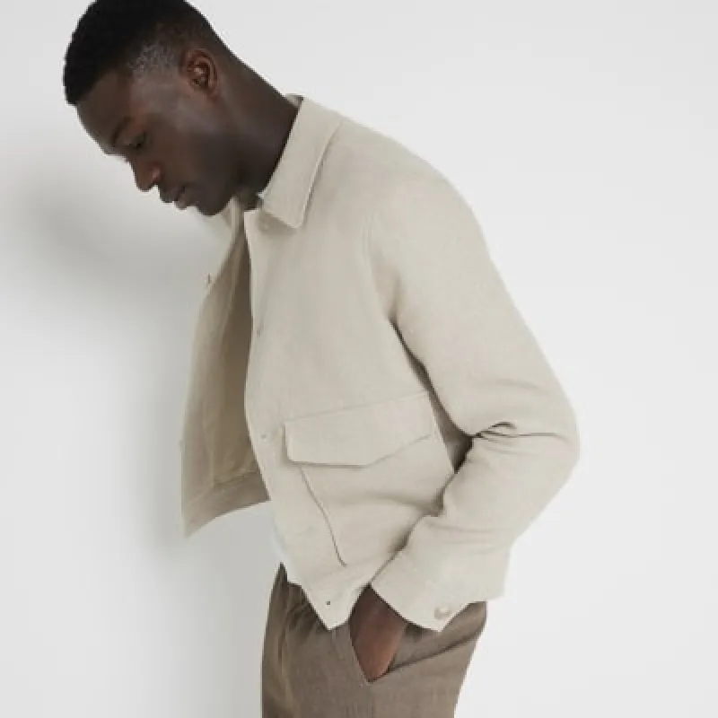 Beige regular fit textured linen blend jacket sold by River Island
