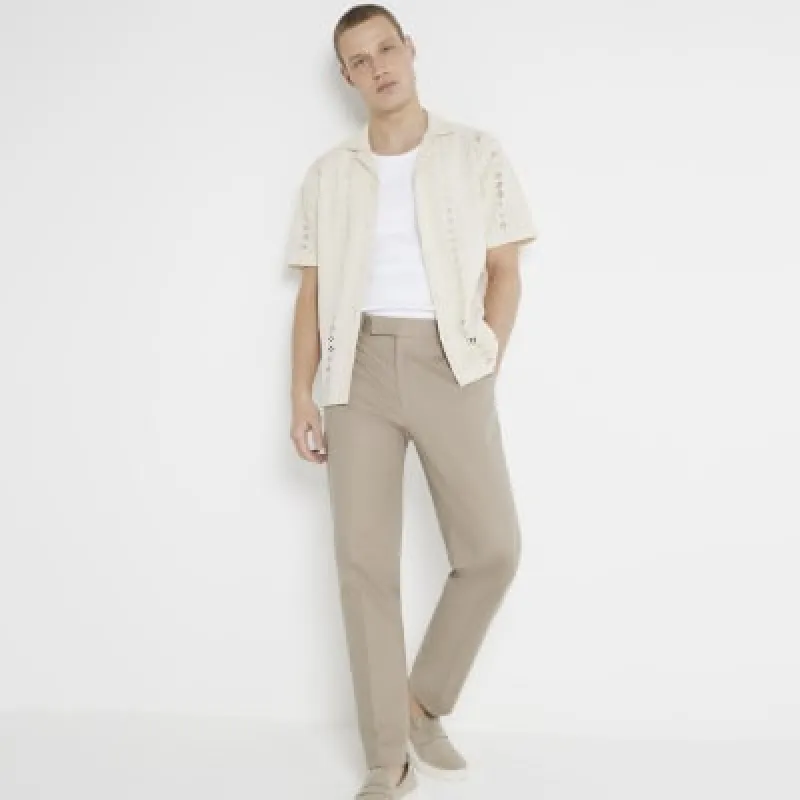 Beige slim fit smart chino trousers sold by River Island