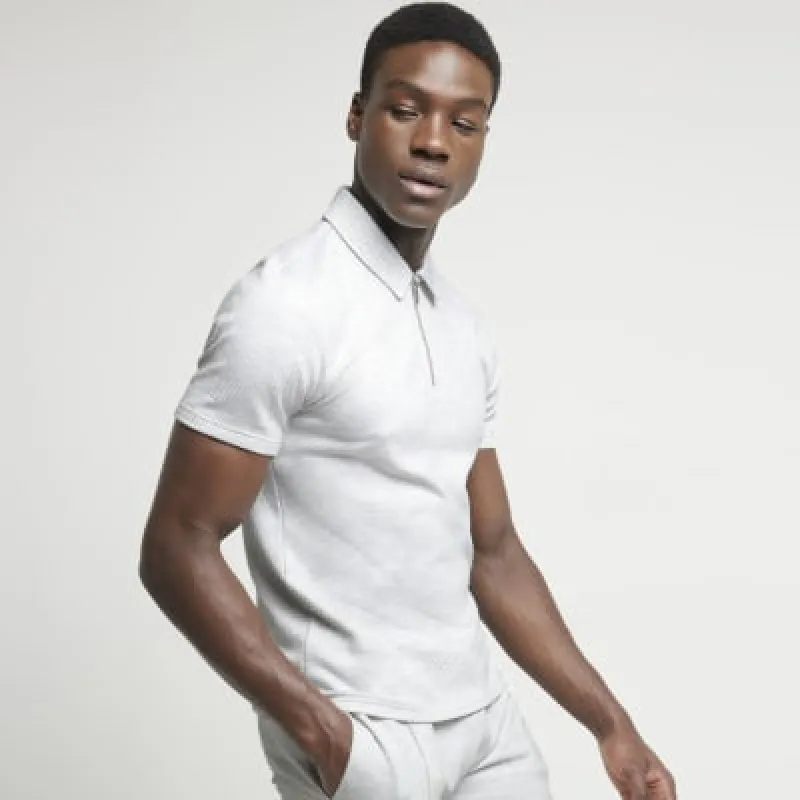 Grey slim fit textured half zip polo sold by River Island