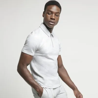 Grey slim fit textured half zip polo sold by River Island