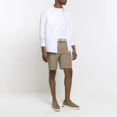 Beige slim fit belted chino shorts sold by River Island