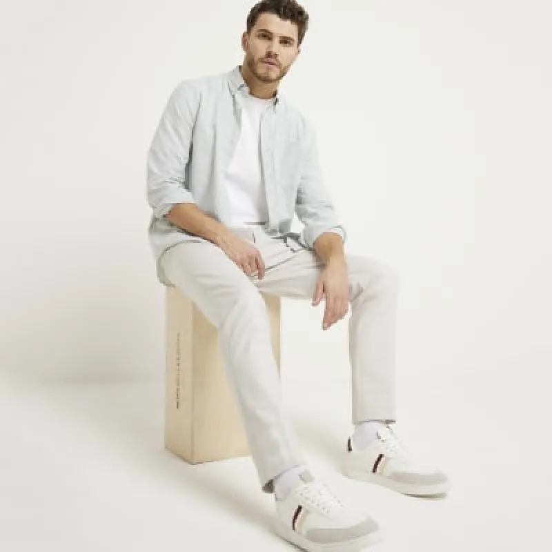 Beige slim fit smart chino trousers sold by River Island