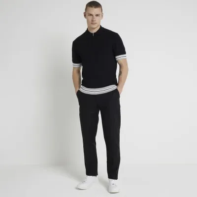 Black slim fit knitted polo shirt sold by River Island