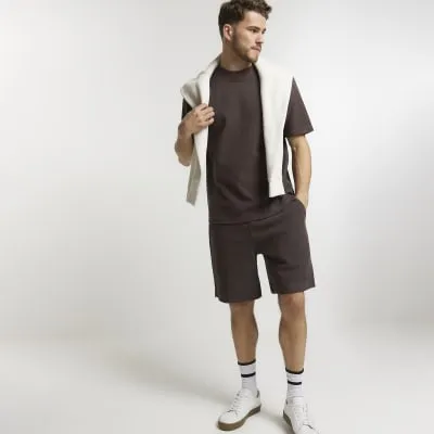 Brown regular fit waffle textured shorts sold by River Island