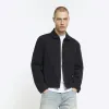 Black regular fit zip up denim jacket sold by River Island