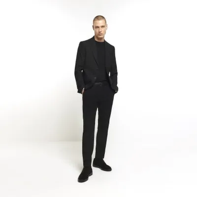 Black skinny fit suit trousers sold by River Island