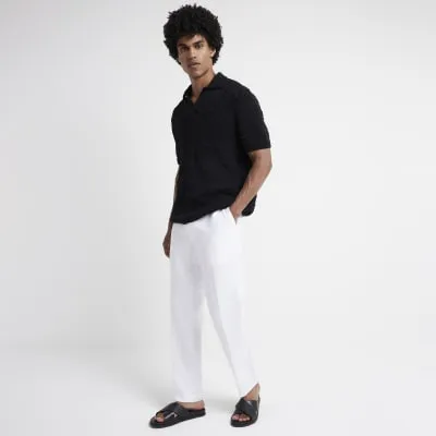 Black regular fit crochet short sleeve polo sold by River Island