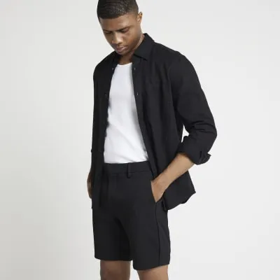 Black slim fit waffle shorts sold by River Island