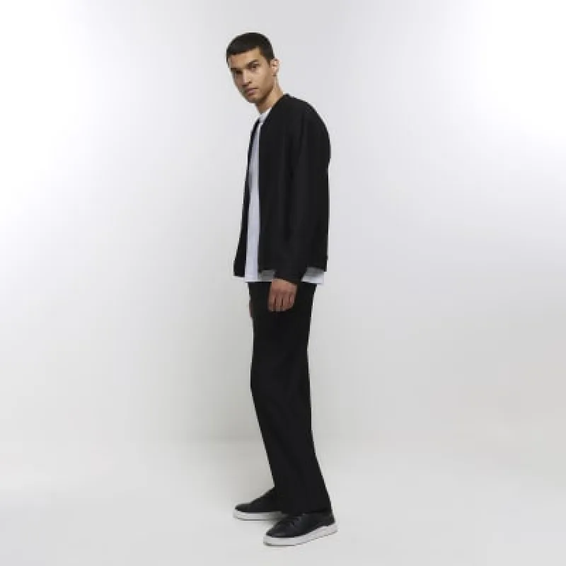 Black tapered fit plisse smart trousers sold by River Island