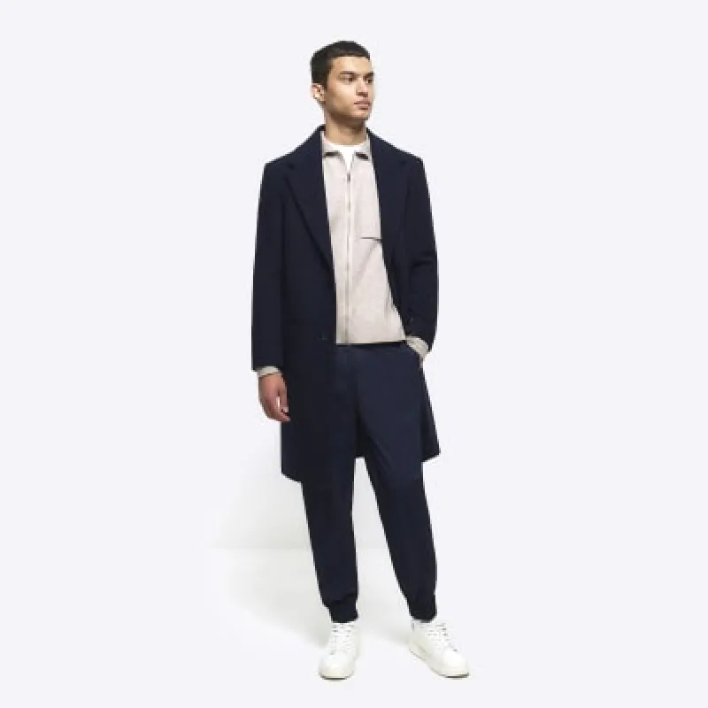 Navy slim fit cuffed smart joggers sold by River Island